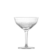 A clear, elegant coupe martini glass with a short stem and wide, shallow bowl. Made from break-resistant Tritan crystal, the bowl features a delicate etched pattern of vertical lines and small ovals. Set against a plain white background.