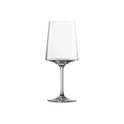 A clear, empty martini glass with a tall, slender stem and wide, flat base. Made from durable Tritan crystal glass, its straight-sided bowl tapers slightly toward the rim. The glass is centered on a plain white background without shadows or reflections.