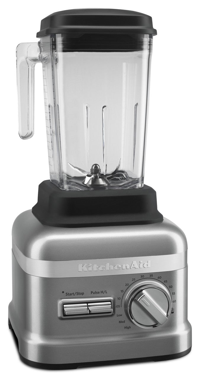 A silver KitchenAid Commercial Bar Blender with a clear 60 oz pitcher, black lid and handle. The base features a numbered speed dial, horizontal start/stop and pulse switches. The pitcher includes durable patented Talon blade metal blades at the bottom.