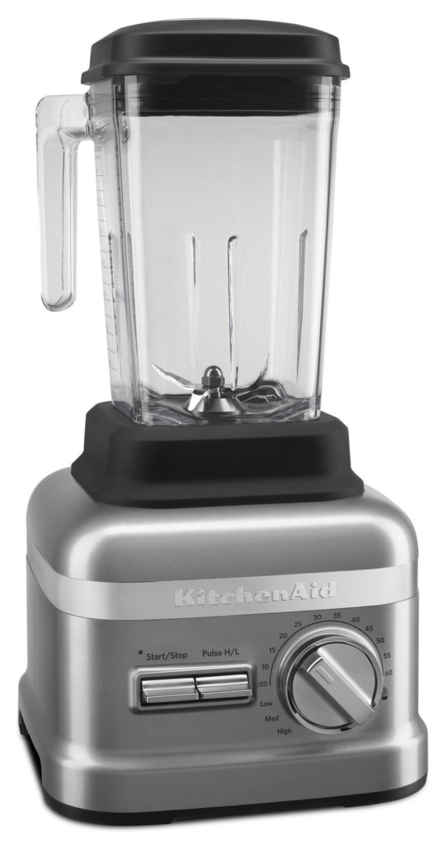 A silver KitchenAid Commercial Bar Blender with a clear 60 oz pitcher, black lid and handle. The base features a numbered speed dial, horizontal start/stop and pulse switches. The pitcher includes durable patented Talon blade metal blades at the bottom.