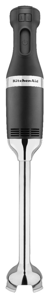A black and silver KitchenAid commercial immersion blender with a comfortable grip, two buttons on top, and a heavy duty 12 stainless steel blending arm featuring a bell-shaped blade. The KitchenAid logo is printed on the main body.