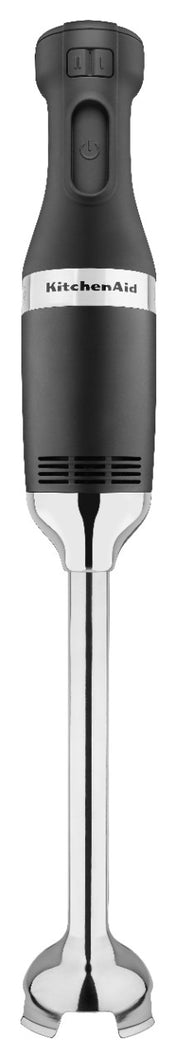 A black and silver KitchenAid commercial immersion blender with a comfortable grip, two buttons on top, and a heavy duty 12 stainless steel blending arm featuring a bell-shaped blade. The KitchenAid logo is printed on the main body.