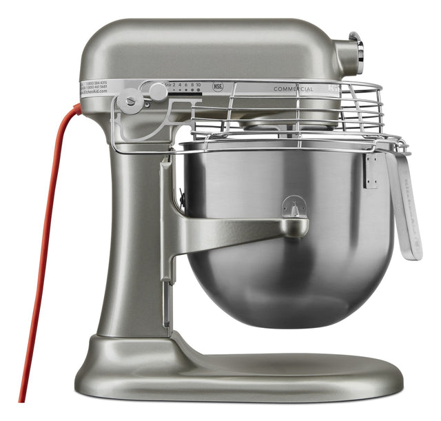 The KitchenAid Commercial Stand Mixer features PowerCore technology and an 8 quart bowl, paired with a robust metallic silver design, safety guard, red power cord, speed control knob, and lever for lifting the bowl—perfect for commercial use.