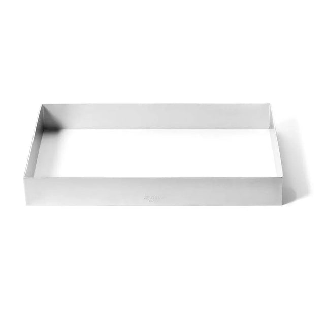 A 1/2 size stainless steel sheet pan extender with straight sides and no base is placed on a white background. The empty frame casts a soft shadow inside, highlighting its open interior and clean, sharp edges.