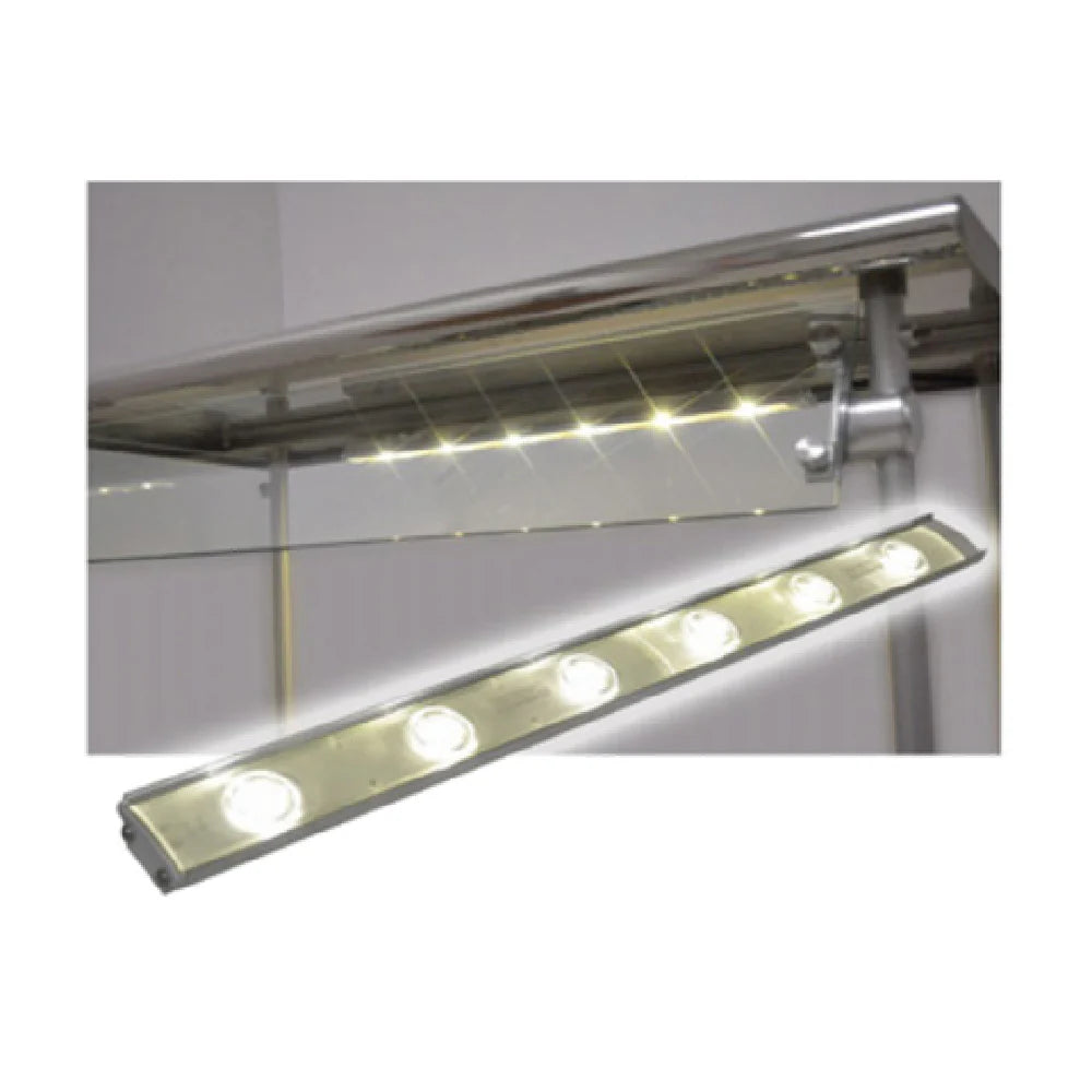 A modern LED lighting strip, 36"W, is mounted above a glass shelf with a metal bracket. The strip has five circular bulbs that emit bright white light, illuminating the area—ideal for use with stainless-top food shields against a plain white wall.