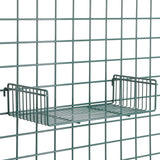 A metal wire grid wall with a Metroseal 3 SmartWall Light-Duty Grid Shelf attached. The rectangular shelf has raised sides, is centered on the green grid, and features minimalist, industrial design with Microban antimicrobial protection.