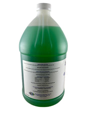 A large plastic gallon jug filled with green liquid. It has a white cap and a white label with black text detailing directions, warnings, and Manitowoc 9405803 information. The product is for professional use and should be diluted with water.