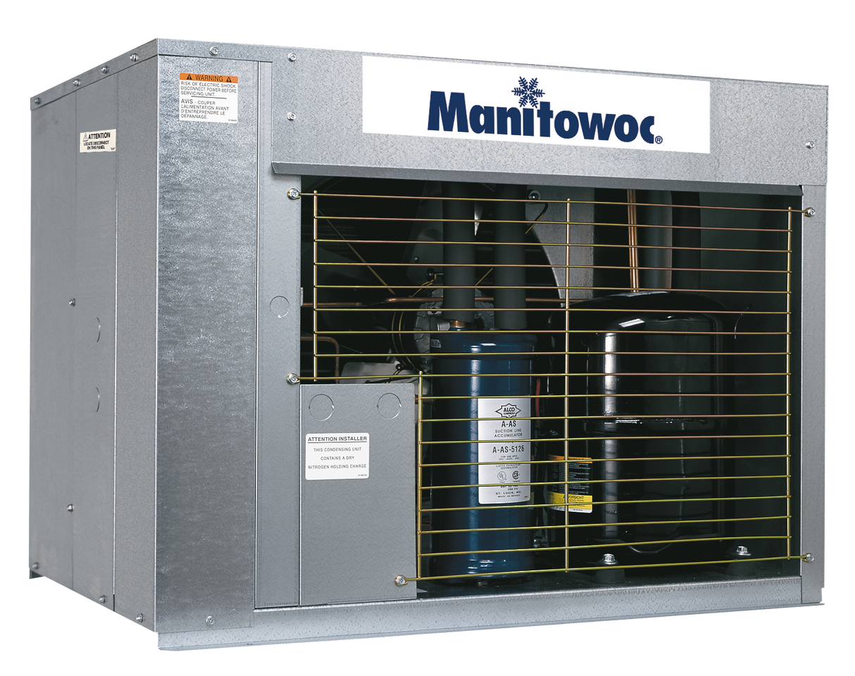A Manitowoc air-cooled commercial ice machine compressor unit with a metal casing, inspection labels, and a wire protective grill in front. The Manitowoc logo is displayed on the front panel above the inner components.