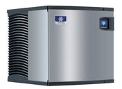 A box-shaped, industrial Indigo NXT Ice Maker features a stainless steel exterior, vented black side panel, blue and white Manitowoc logo, digital control display near the top right, and is a reliable air-cooled ice machine.