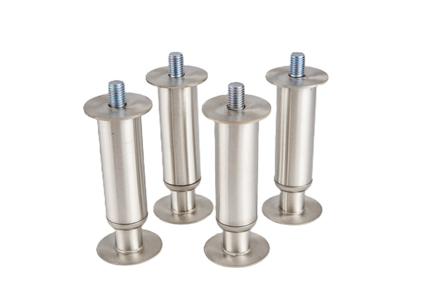 Four cylindrical stainless steel legs with wide round bases and adjustable flanged feet stand upright on a white background. The brushed silver finish and circular plates at both ends make these perfect legs for D-Series bins.