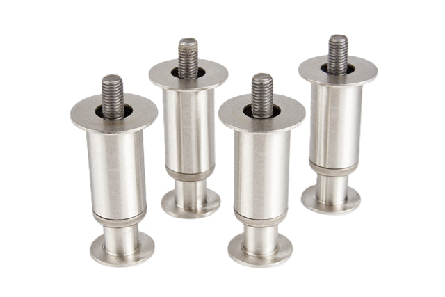 Four metal threaded bolts with flanged feet and wide cylindrical bodies stand upright on a white background. Each Manitowoc adjustable stainless steel bolt features a flat circular base and a visible threaded rod protruding from the top.