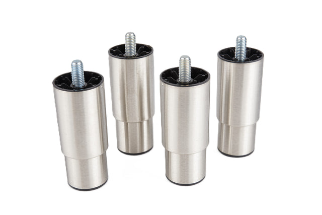 Four cylindrical adjustable stainless steel legs with a brushed silver finish and threaded screws on top stand upright on a white background. The bases have black caps, and the tops are open, exposing the threaded metal rods.