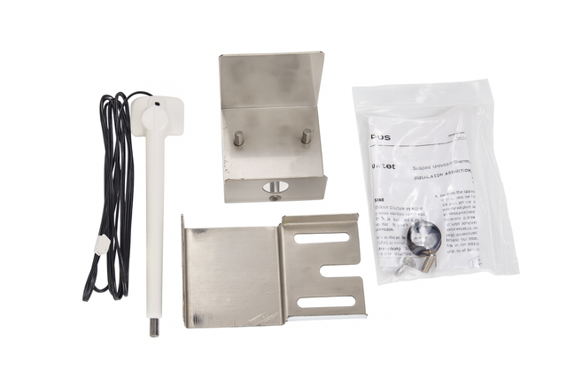 The image shows an Indigo NXT Series Dispenser Thermostat Kit with a white temperature sensor probe, black cord, two stainless steel brackets, and a bag containing screws and instructions—essential for preventing ice machine overfill.
