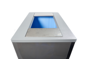 A close-up view of a modern, rectangular recycling bin with a silver metallic top, similar in finish to a Manitowoc Indigo NXT ice machine. The plain white background keeps the replacement bin adapter as the central focus of the image.