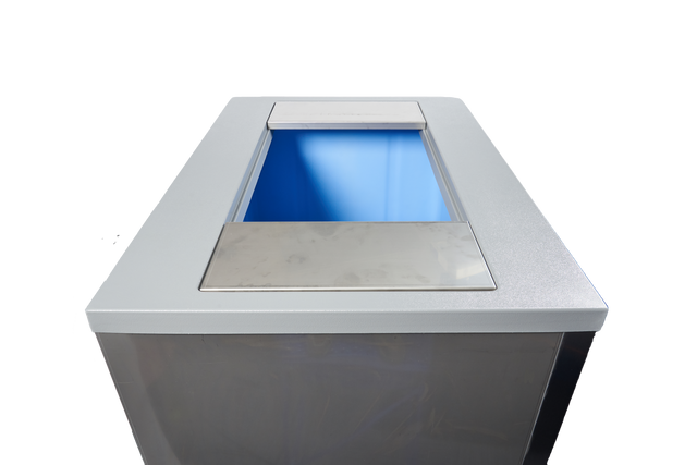 A close-up view of a modern, rectangular recycling bin with a silver metallic top, similar in finish to a Manitowoc Indigo NXT ice machine. The plain white background keeps the replacement bin adapter as the central focus of the image.