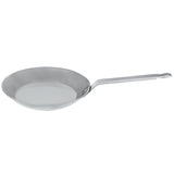 Side view of the Matfer Bourgeat 062003 10-1/4 inch black steel frying pan with riveted handle for commercial stovetops