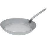 Matfer Bourgeat 15-3/4 inch black steel frying pan with heavy-duty riveted handle for high-volume commercial cooking