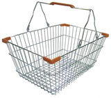 A metal shopping hand basket with steel handles, orange plastic grips, and a grid-patterned base. The handles are upright, and the empty basket is shown against a plain white background.