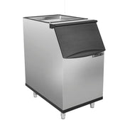 A stainless steel ice storage bin with four metal legs, a black plastic flip-up lid, and MAXX ICE branding on the front. The rectangular bin features an industrial look and pairs perfectly with your commercial ice maker setup.