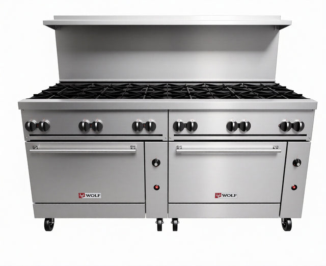 A large stainless steel commercial restaurant range with twelve gas burners, two ovens below—one a convection oven—multiple control knobs, and a high backsplash; Wolf brand logo on both oven doors. The unit stands on wheels for mobility.