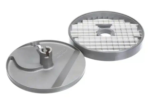 Two round, gray metal discs for a Robot Coupe food processor. One disc has a raised central part with a slicing blade, while the other features a grid of rectangular openings from the Dicing Kit. Both have a central hole for attachment to the machine.