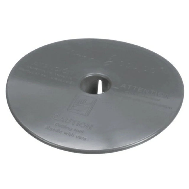 A round, flat, metallic disc with a central hole and slightly raised center, this Dicing Grid Protector features indented warning text and an icon advising caution. Designed for large machines like Robot Coupe, it has a smooth, reflective finish.