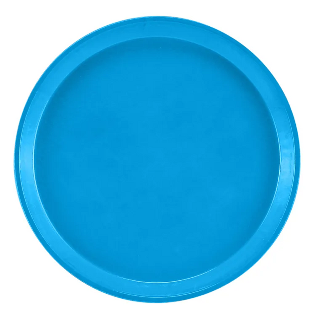 A round, flat, solid blue Serving Camtray with a slightly raised edge is shown against a white background. Made of durable fiberglass, this tray is dishwasher safe and uniformly colored without any patterns or designs.