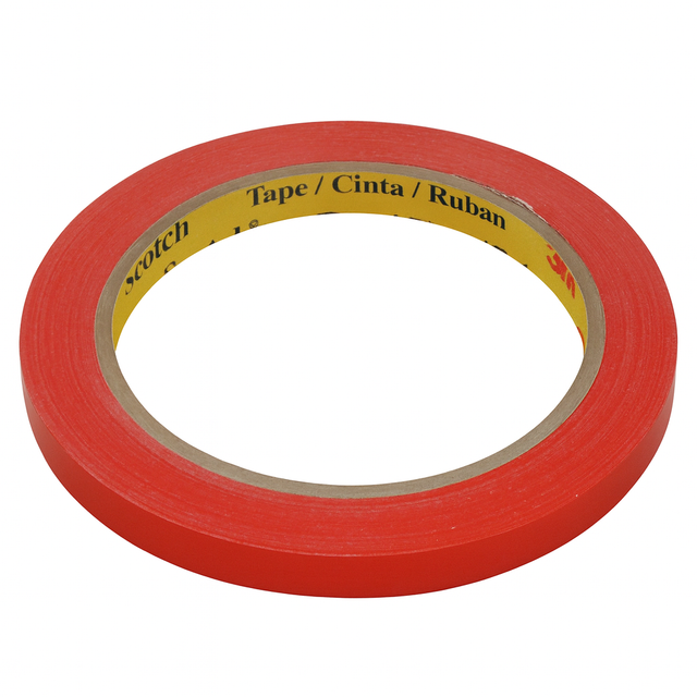 A roll of red Scotsman tape with a yellow inner label that reads Tape / Cinta / Ruban. This thin, circular tape with a visible cardboard core is ideal for ice bagging supplies or use with an ice bagger. The 3M brand appears faintly on the label.