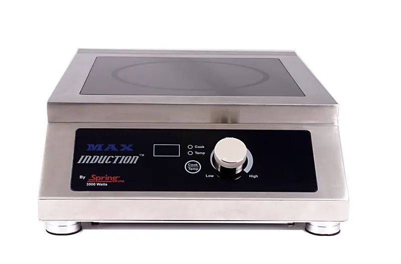 The stainless steel MAX Induction Cook & Hold Range by Spring USA is a countertop induction cooktop featuring a black control panel, digital display, large dial, two buttons, and SmartScan technology for precise cooking from low to high.