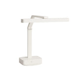 A modern, minimalist white desk lamp with a rectangular base, straight adjustable arm, and long horizontal light bar. The lamp’s geometric design features clean lines and sharp angles with a versatile multi-position setup.