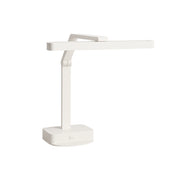 A modern, minimalist white desk lamp with a rectangular base, straight adjustable arm, and long horizontal light bar. The lamp’s geometric design features clean lines and sharp angles with a versatile multi-position setup.