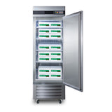 A tall, stainless steel commercial reach-in freezer with the door open, revealing multiple shelves holding stacked white boxes with green and black labels. The unit has a digital temperature display and is on wheels.