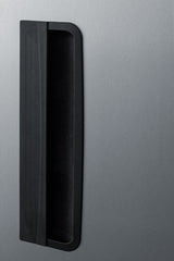 A close-up of a modern refrigerator door handle, black and rectangular, mounted vertically on a smooth, brushed stainless steel surface, showing part of the appliance’s sleek exterior design—ideal for use as a commercial reach-in freezer in professional settings.