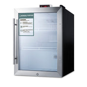 A commercial medical refrigerator with a glass door, metal handle, and visible interior shelves. The control panel is on top, displaying 4.0. A warning label with text and icons is affixed to the door. This NIST calibrated refrigerator is silver and black with a modern design, making it ideal for healthcare settings requiring precise temperature control.