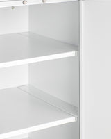 Close-up of a white metal shelving unit with two adjustable shelves, viewed from an angle. Ideal for kitchenettes or as a wall cabinet, the shelves are empty, and the edges and brackets are visible, highlighting the clean, minimal design. The lighting is bright, showing smooth surfaces.