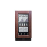 A compact, panel ready glass-front refrigerator with a dark wood frame, styled as an undercounter commercial beverage center. It’s stocked with clear glass bottles labeled “Ginger Ale” and boxed beverages, set against a plain white background.