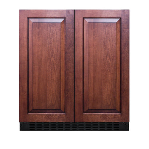 A built-in undercounter refrigerator-freezer with panel-ready doors, featuring two paneled wood fronts in a dark brown finish and recessed rectangular designs. The lower front includes a black vent grille, while the automatic defrost refrigerator seamlessly blends with traditional cabinetry.