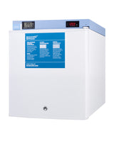 A white Accucold medical freezer with a blue top panel displays two digital temperature readings, both showing -20.3°C. This compact all-freezer features a blue information label on the door and a lock located at the bottom center of the front door. NIST calibrated for reliable temperature accuracy, it stands against a plain white background.