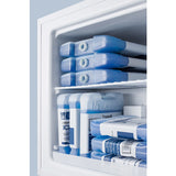 A compact freezer filled with neatly stacked blue gel ice packs on both the upper shelf and lower section. The rectangular ice packs, some labeled, are organized in an orderly manner against a light blue freezer interior.