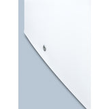 A close-up of a smooth, white, curved bathtub surface with a small silver drain located off-center. The soft blue background creates a clean, minimalist look—much like the sleek design of a compact freezer with strong geometric lines and contrasting colors.