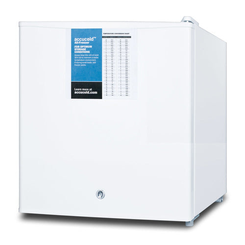 A small, white, square-shaped Accucold Undercounter Freezer with a single door, featuring a blue and white temperature chart and instruction label on the front. Manual defrost and key lock are included. The freezer sits on four small feet.