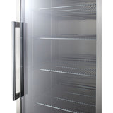 A close-up view of an empty commercial refrigerator with a glass door, metal handle, and several adjustable shelves inside. The refrigerator appears clean and unused, with shelves evenly spaced and the interior reflecting light.