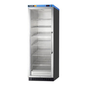 A tall, upright commercial refrigerator with a glass door, metal frame, and five empty adjustable chrome shelves. The control panel and brand label are at the top, and the unit has a black base and sides. The refrigerator is lit inside and stands alone.
