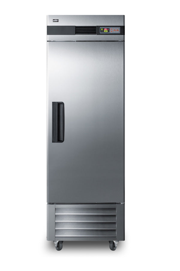 A tall, stainless steel commercial upright freezer stands on four wheels. It has a black handle on the left side of its front door, a digital control panel at the top, and vented panels at the base. The overall design is industrial and modern.