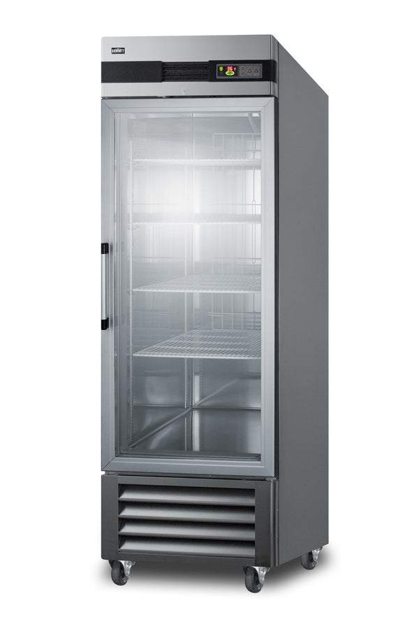 A tall, stainless steel commercial refrigerator with a single glass door, metal handle, and four wire shelves inside. This glass door refrigerator stands on four caster wheels and features a digital control panel on top and vented panels at the bottom.