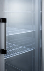 A close-up view of the interior of an empty glass door refrigerator reveals a pristine commercial appliance with a metal handle and several wire shelves. The shelves are clean, and the well-lit, unused fridge showcases the sleek design typical of a modern commercial refrigerator.