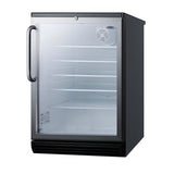 A small, black glass door refrigerator with a clear glass front is shown. The fridge is empty, featuring four interior wire shelves and a fan inside the top right corner. The door has a large metal handle on the left side. This commercial refrigerator is positioned on a white background.