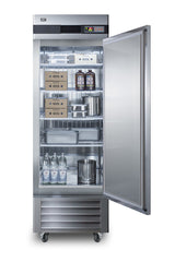 A commercial reach-in refrigerator with the door open, showing shelves stocked with boxes, metal containers, two large cold brew coffee jugs, three glass bottles, and a metal canister. The interior of this stainless steel refrigerator is well-lit and organized.