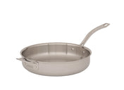 A stainless steel buffet sauté pan with an aluminum core features a wide, flat base, straight sides, and a sturdy, long handle secured by rivets. A small helper handle sits opposite. The background is plain white.