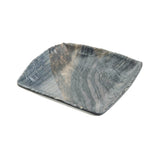 A rectangular, shallow melamine serving tray with gently curved edges. The surface features swirled patterns in gray, black, and subtle brown tones for a marbled look, resembling barnwood pattern. The background is white.